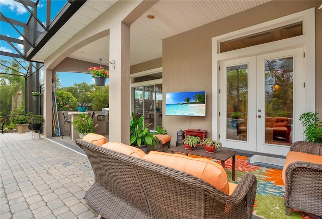 view of patio / terrace with an outdoor hangout area, french doors, and an outdoor kitchen