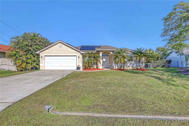 view of front facade with a garage, a front yard, and solar panels