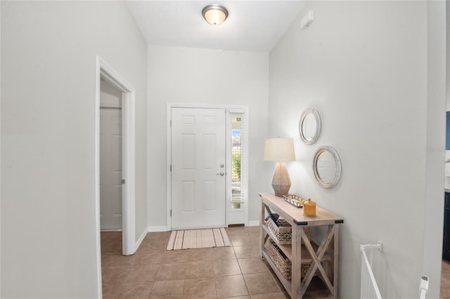 foyer featuring light tile patterned floors