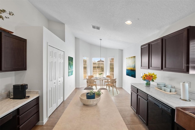 kitchen with vaulted ceiling, black dishwasher, hanging light fixtures, light tile patterned floors, and dark brown cabinetry