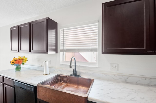 kitchen with sink, dark brown cabinets, and black dishwasher