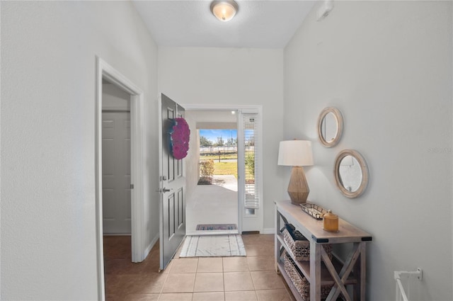 entryway featuring light tile patterned floors