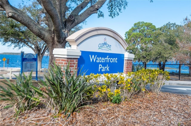 community sign with a water view