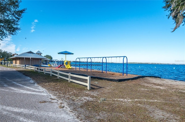 view of jungle gym featuring a water view