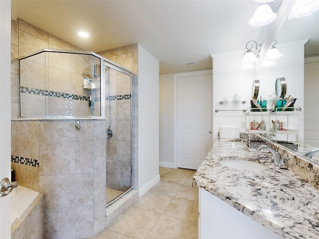 bathroom with vanity, an enclosed shower, tile patterned flooring, and a notable chandelier