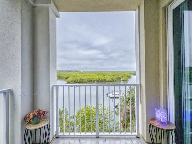 balcony featuring a water view