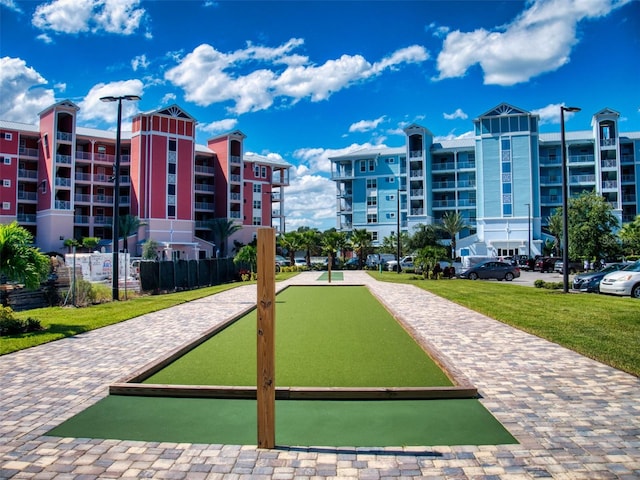 view of property's community featuring a yard