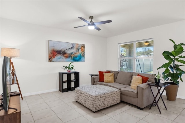 tiled living room with ceiling fan