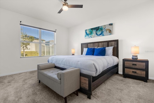 bedroom featuring light carpet and ceiling fan