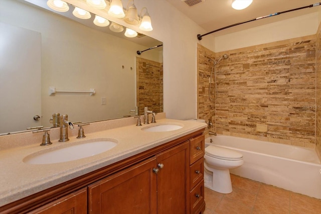 full bathroom featuring tile patterned floors, vanity, toilet, and shower / bathtub combination