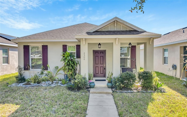 bungalow with a front yard