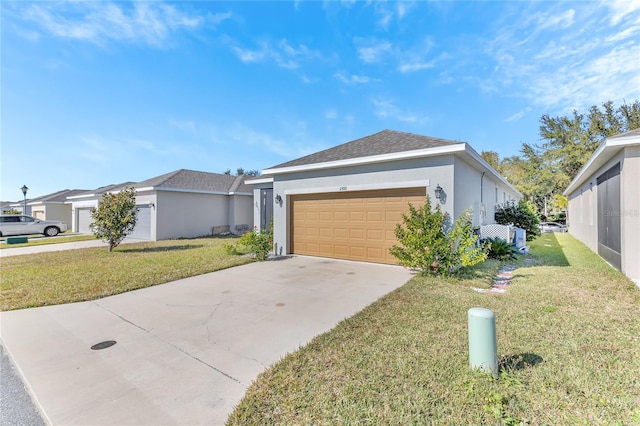 view of front of property featuring a garage and a front yard