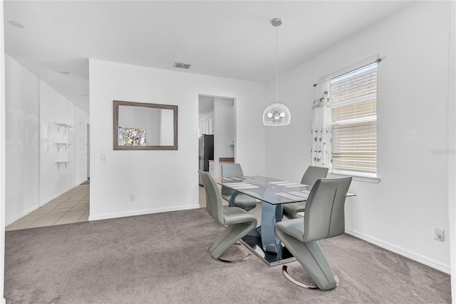 view of carpeted dining space