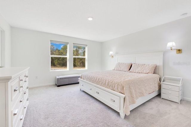 bedroom featuring light carpet