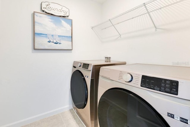 clothes washing area with washing machine and clothes dryer