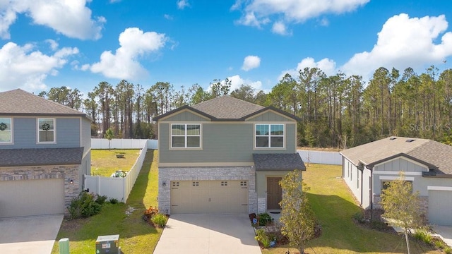 view of front facade with a garage and a front lawn