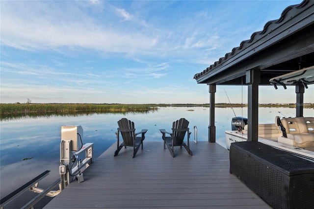 dock area featuring a water view