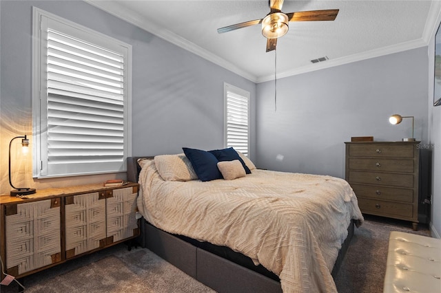 bedroom with dark carpet, ornamental molding, and ceiling fan