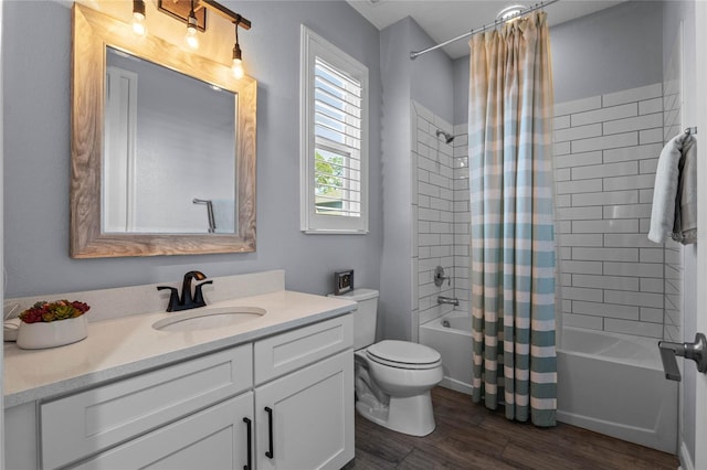 full bathroom featuring vanity, wood-type flooring, shower / bath combination with curtain, and toilet