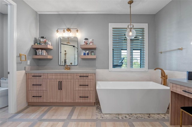 bathroom featuring vanity, tile patterned floors, a tub, and tile walls