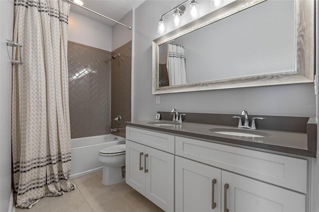 full bathroom featuring vanity, tile patterned floors, toilet, shower / bathtub combination with curtain, and a textured ceiling