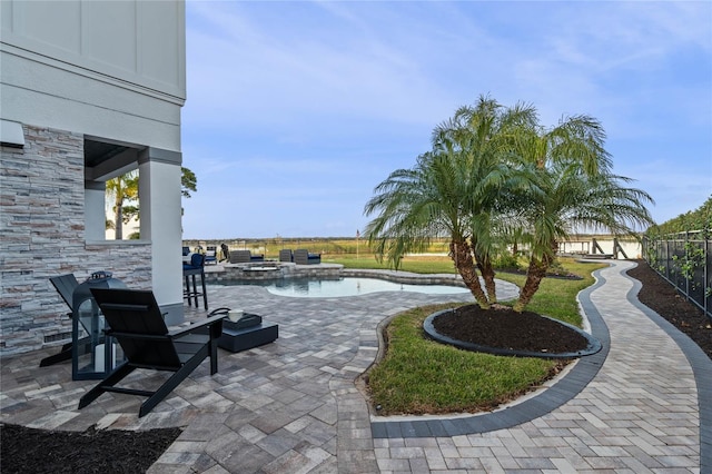 view of patio featuring a fenced in pool