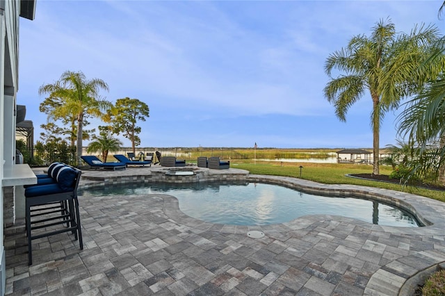 view of pool featuring an in ground hot tub and a patio