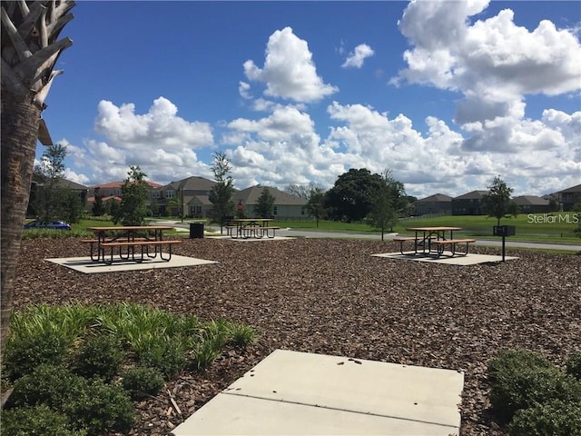 view of home's community featuring a lawn