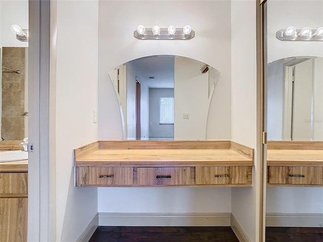 bathroom featuring vanity and walk in shower