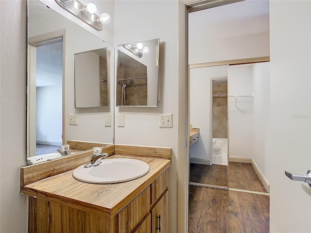 bathroom with vanity and hardwood / wood-style floors