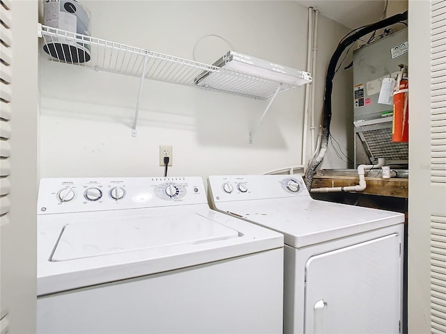 washroom with washing machine and clothes dryer