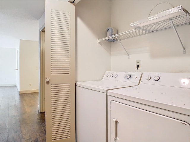 laundry room featuring wood-type flooring and washer and dryer