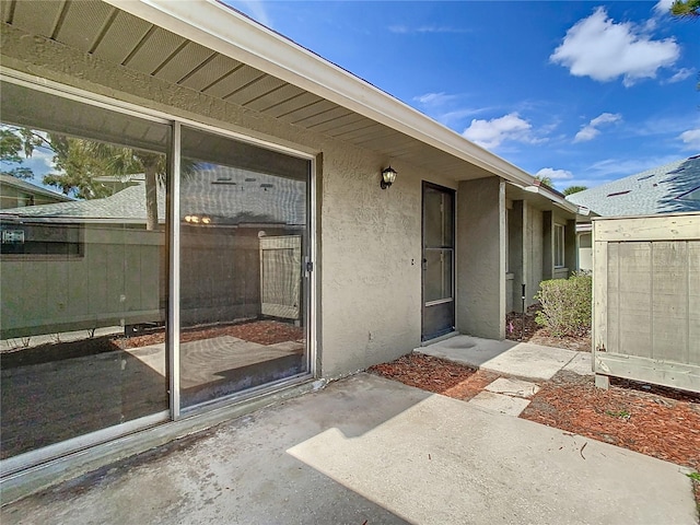 entrance to property with a patio