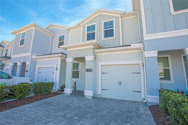 townhome / multi-family property featuring a garage