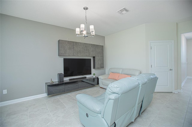 living room featuring a chandelier and light tile patterned flooring