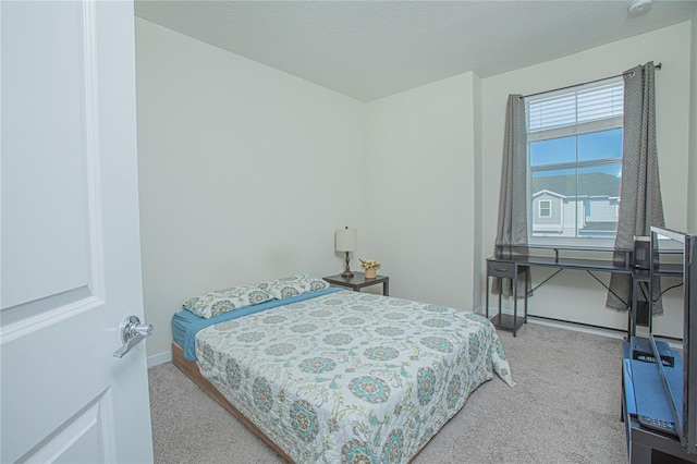 bedroom featuring light colored carpet