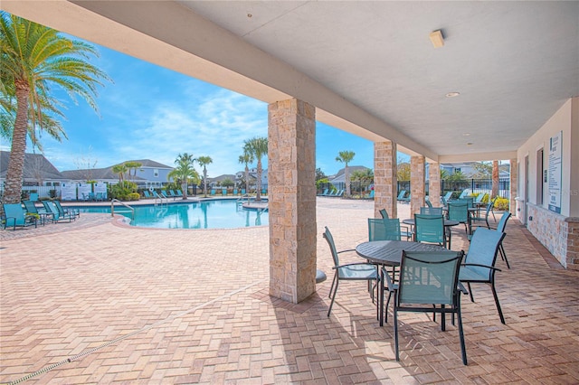 view of swimming pool featuring a patio area