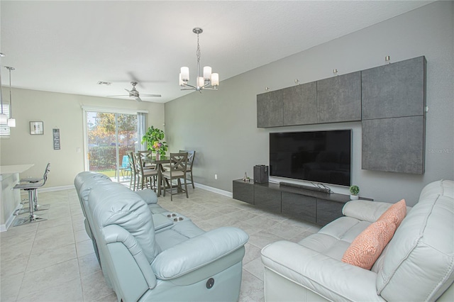 4708 Tribute Trl, Kissimmee, FL 34746 - living area featuring baseboards, visible vents, light tile patterned floors, and ceiling fan with notable chandelier
