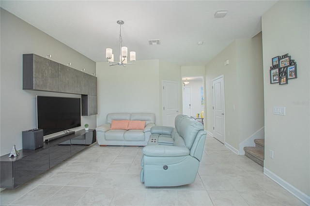 4708 Tribute Trl, Kissimmee, FL 34746 - living room with an inviting chandelier, stairway, light tile patterned floors, baseboards, and visible vents