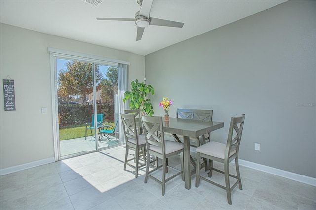 4708 Tribute Trl, Kissimmee, FL 34746 - dining space with light tile patterned flooring, ceiling fan, and baseboards