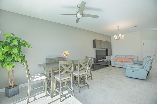 4708 Tribute Trl, Kissimmee, FL 34746 - dining room with visible vents, ceiling fan with notable chandelier, and light tile patterned flooring