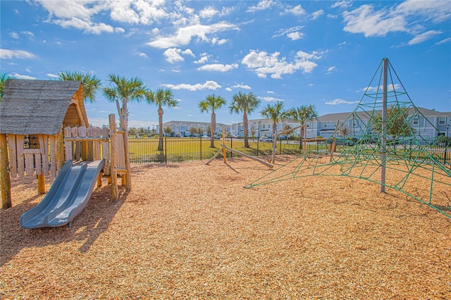 4708 Tribute Trl, Kissimmee, FL 34746 - communal playground featuring fence and a residential view