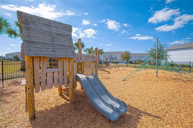 4708 Tribute Trl, Kissimmee, FL 34746 - view of jungle gym featuring fence and a residential view
