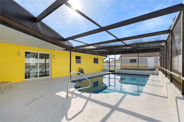 view of swimming pool with a lanai and a patio area