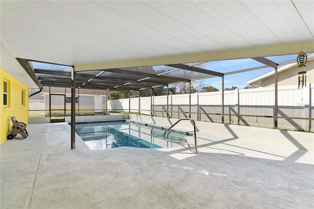 view of swimming pool with a lanai and a patio