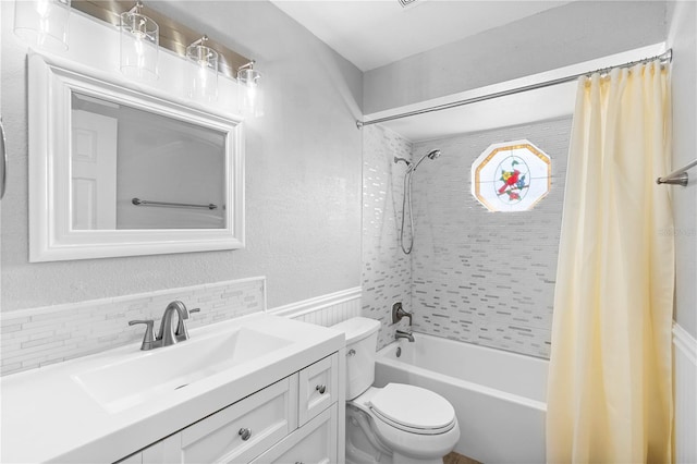 full bathroom featuring shower / tub combo, vanity, and toilet