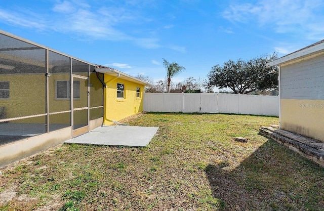 view of yard with glass enclosure