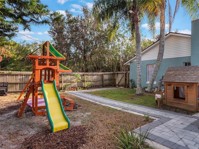 view of jungle gym with a lawn