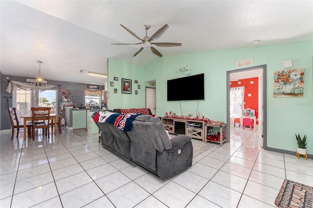 living room featuring ceiling fan and vaulted ceiling