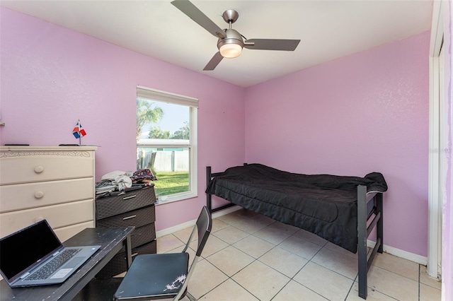 tiled bedroom with ceiling fan